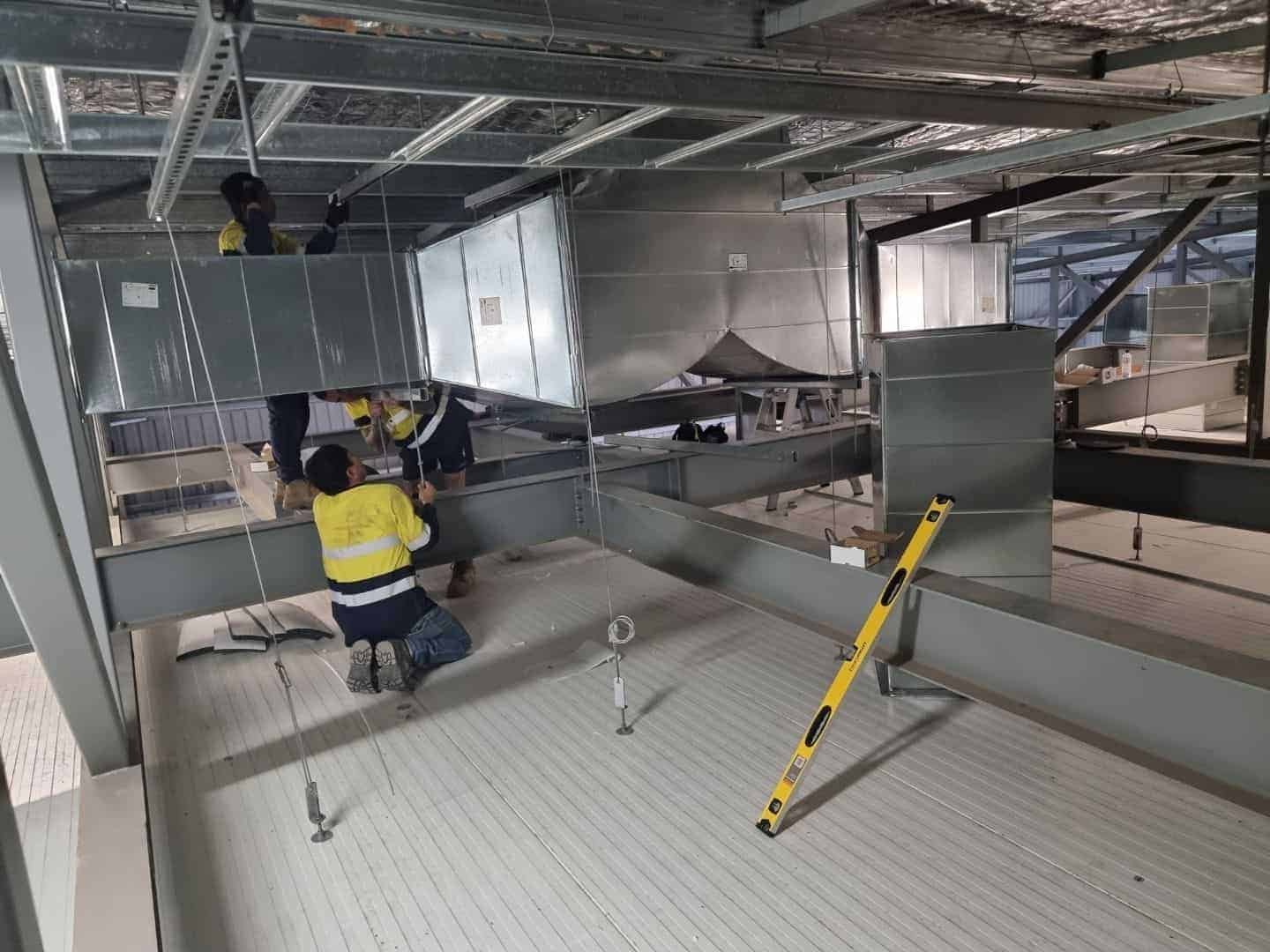 workers spraying passive fire protection